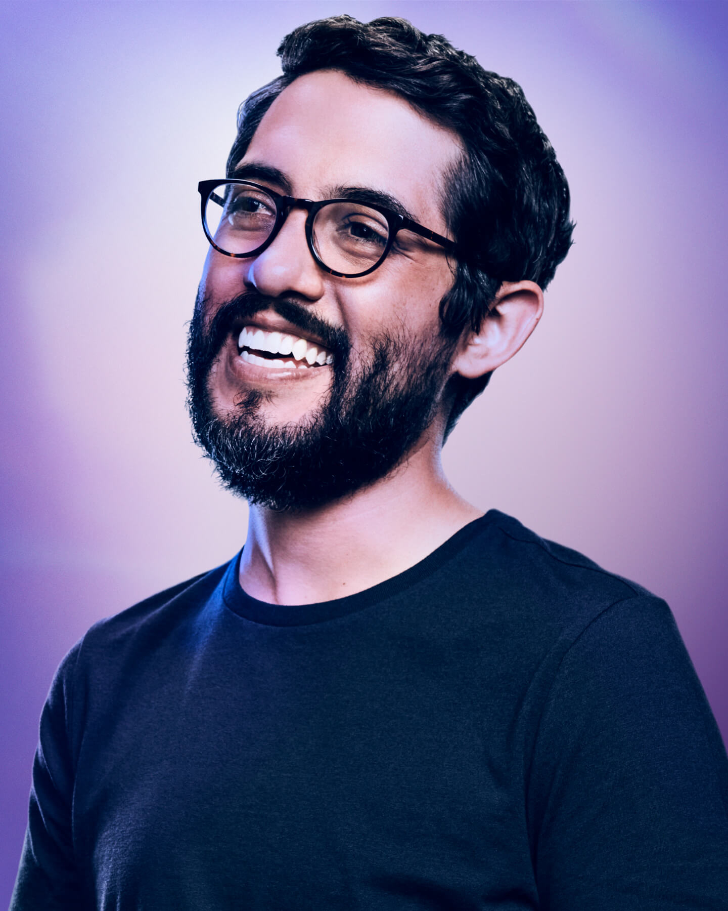 Carlos López Estrada smiling.