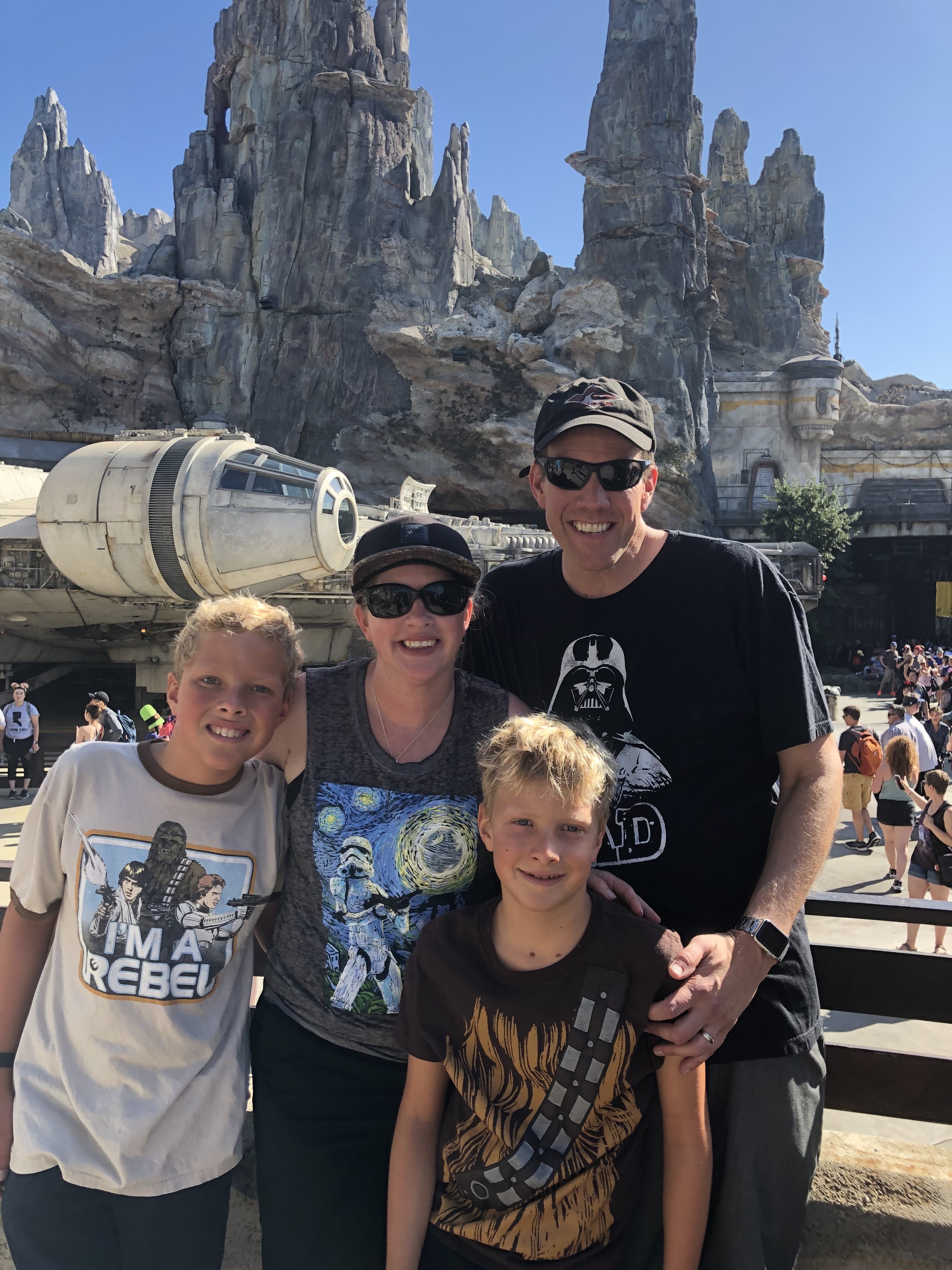 Doug and his family smiling for a family photo.