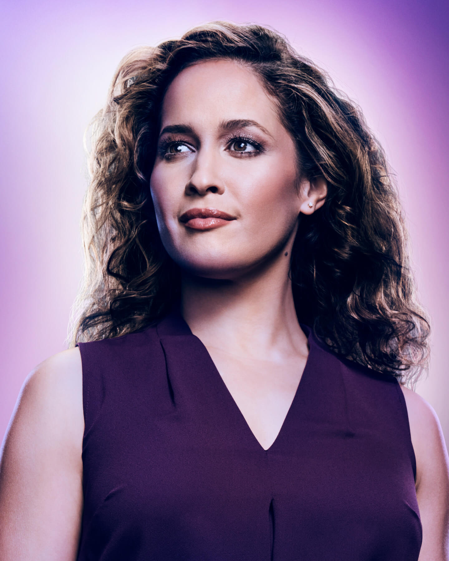 Jaina Lee Ortiz looking off in the distance and smiling.