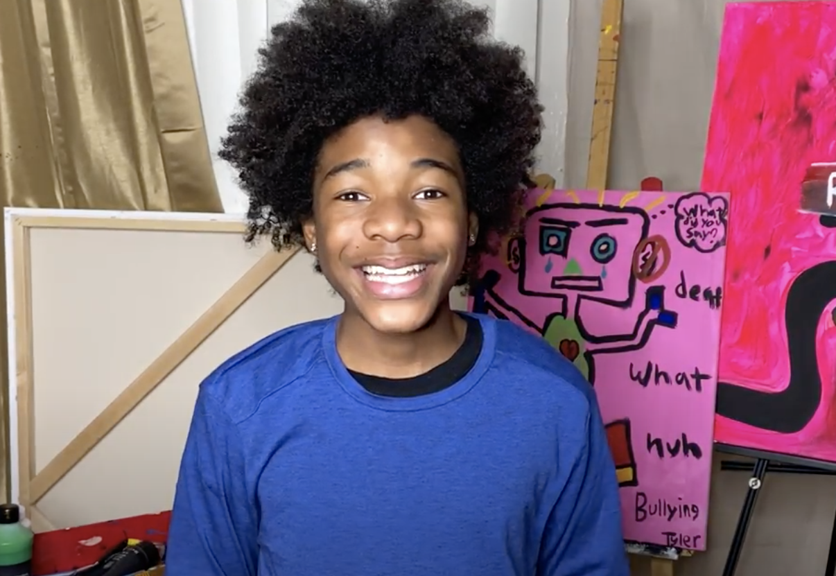 image of Tyler smiling at the camera.